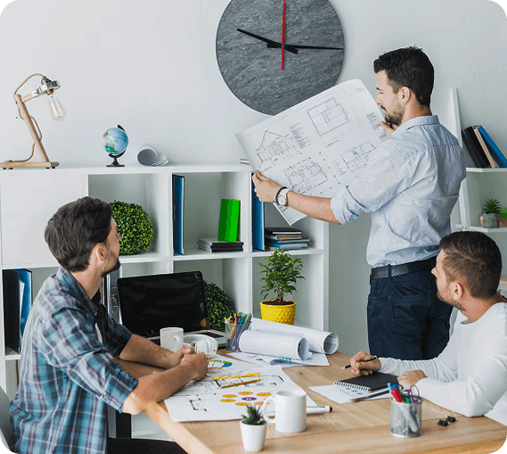 Team collaborating on architectural plans